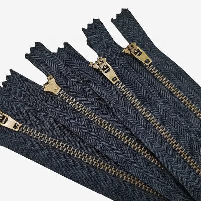 China ODM 4.5yg 4yg 5yg automatic double lock factory lock metal zipper pulls wholesale jeans plugged,brass zipper with semi automatic lock slid for sale