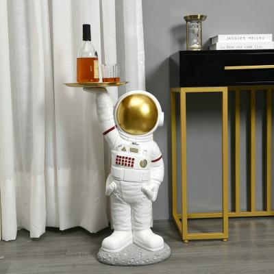 China Europe Large Floor Landing Lounge Astronaut Statue With Gold Metal Sculpture Storage Tray Plate for sale