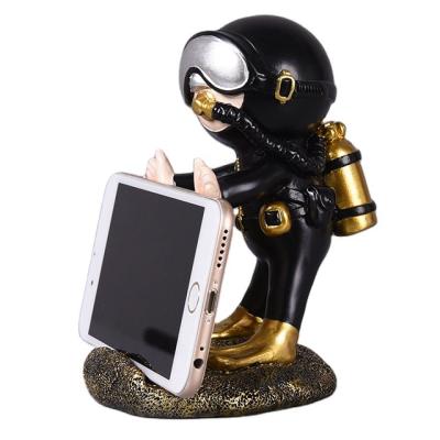 China Home Decoration The Latest Diver Table Accessories Desk Design Decoration Decorative Gift Home Mobile Phone Holder for sale