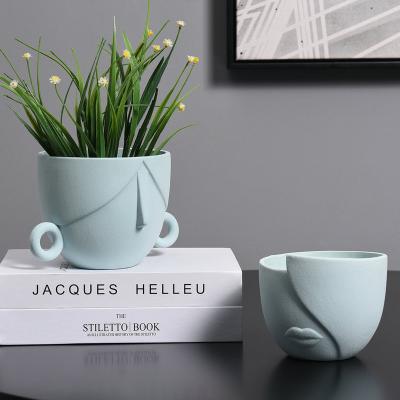 China Europe modern decorative ceramic flower pots face indoor simple main creative planter Europe small and planters flower pot for sale