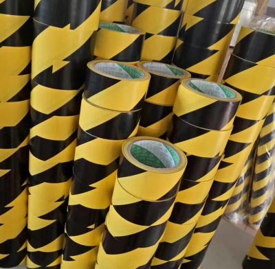 China 48MM Wide  PVC Black And Yellow Warning Tape Warehouse Floor Zoning Tape for sale