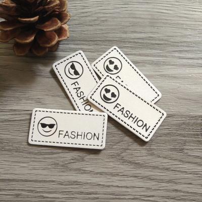 China Custom Personalized 3D Logo PU Debossed Leather Labels For Leather Hats Patch Cap for sale