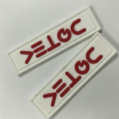 China Custom Flag Patches Silicone 3D Apparel Rubber Tag Label for sale