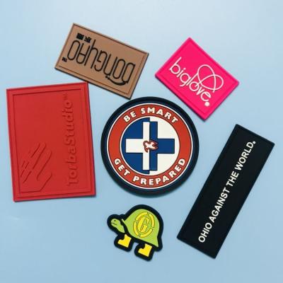 China custom 3D heat press pvc silicone embossed brand soft rubber patch for clothing for sale