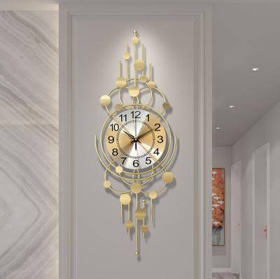 China Contemporary creative fancy simple wall clock living room clock living room decoration iron luxury light luxury wall clock for sale