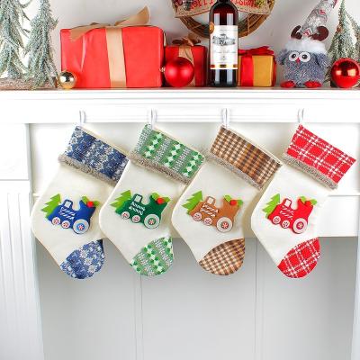 China Christamas Home Decoration Gift Bag New Knitted Christmas Canvas Candy Bag Cute Locomotive Christmas Bangs Tree Gift Bag Stocking Pendant for sale