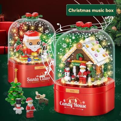 China Battery Operated Children's Music Box Christmas Gift Dust Cover Rotating Music Snow Building Block for Kid Room Decoration for sale