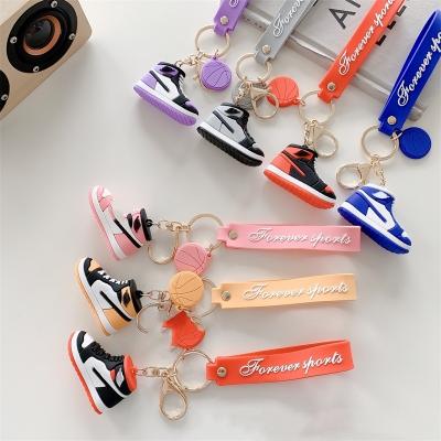 China Easy to Install and Remove 3D Rubber PVC Shoe Basketball Key Chain Phone Case Wholesale Key Ring with Wrist Strap for sale