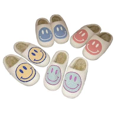 China Fashion trend face smiley slippers autumn and winter couples smile slippers women's home cute cartoon indoor smiley slippers for sale