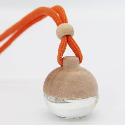 China Non Spill 5ml Ball Shaped Empty Hanging Car Air Freshener Perfume Diffuser Bottle With Wooden Cap And Rope for sale