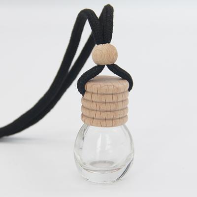 China Non Spill Wholesale Wood Cap Diffuser Car Empty Hanging Stain Supplies Perfume Bottle for sale