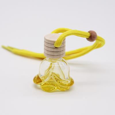 China No Puddle Supplies Manufacturer Custom Coloful Glass Car Perfume Bottle Hanging In The Car With Wooden Cap for sale