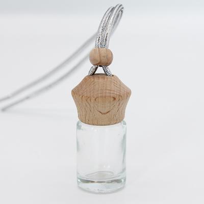 China Non Spill Stain Supply 5ml Car Air Freshener Glass Hanging Perfume Diffuser Bottle With Wooden Cap for sale