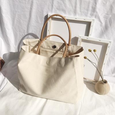 China Reusable Eco Friendly Natural Color Recycled Cotton Canvas Tote Shopping Bag With Leather Handle for sale