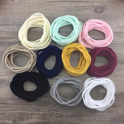 China Popular 500 Pcs 34 Solid Color Nylon Elastic Headbands Super Soft Stretchy Nylon Headbands One Size Fits Plus for sale