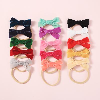 China Popular Chubby Velvet Bow Soft Nylon Headbands For Babies Hand Tied Stretch Hair Bands Accessories Girls Christmas Gift for sale