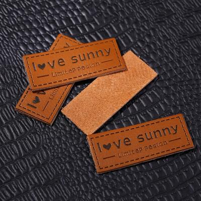 China Sustainable Apparel Garment Custom LOGO Embossed PU Leather Patch for sale