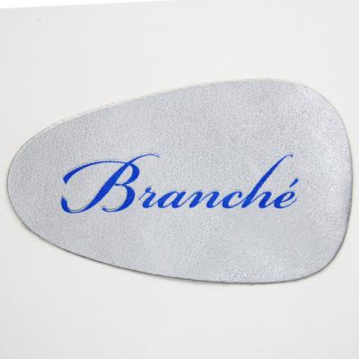 China Durable Genuine Leather Patches Labels With Embossed Foil Printing For High Quality Jeans Caps for sale