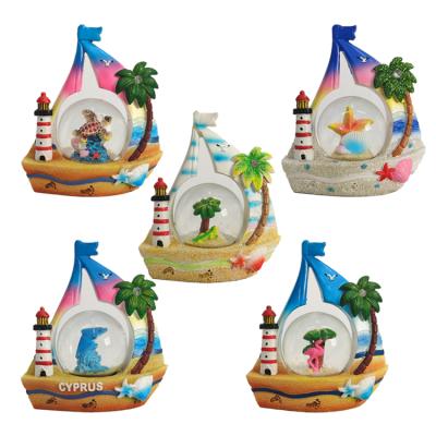 China Coastal Resin Crafts Sailing Glass Snow Globe Tourism Souvenir for sale