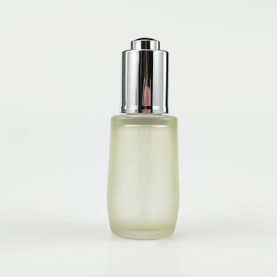 China Essential Oil Cosmetic Bottle Push Button 30ml Cosmetic Dropper Bottle for sale