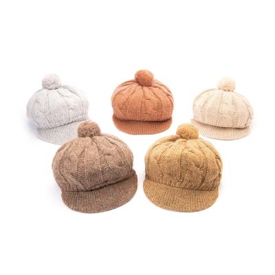 China Warm and Comfortable Outdoor Plain Pom Pom Flat Visor Wool Winter Knitted Beret Hat for sale