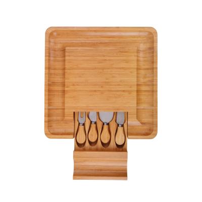 China Amazon Best Seller Sustainable Bamboo Serving Tray With Cheese Knife Board Set Slide Out Drawer Cheese Cutter Board for sale