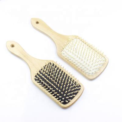 China Custom Logo Wooden Hair Brush Paddle Detangling Cushion Hair Brush with Wooden Pins for sale