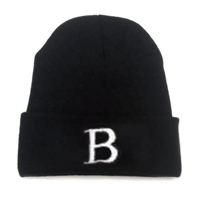 China COMMON Cheap Custom Made Acrylic Knit Winter Hat Black Solid Alphabet Beanie Knitted Hat With Embroidery Logo for sale