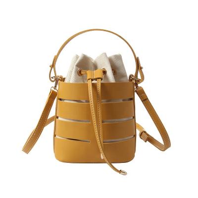 China Women's Shoulder Bag Fashion Multi-Layer PU Hollow Out String Messenger Bucket Softback Leather Simple Solid PU H for sale