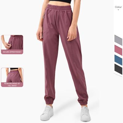 China Other Trendy Athletic Sports Wear Quicky Yoga Loose Dry Pants With Zipper Pockets Fitness Joggers for sale