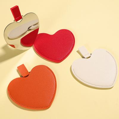 China Personalized Mini Small Irregular Pocket Wholesale Cosmetic Hand Mirror Makeup Stainless Steel Heart Shape Irregular Mirror for sale