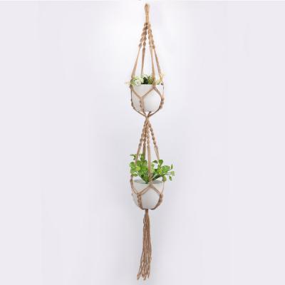 China Classic Home Decor Two Tier Macrame Plant Hanger Knotted Jute Hanging Garden Basket Living Room Indoor Outdoor Hanging Planter for sale