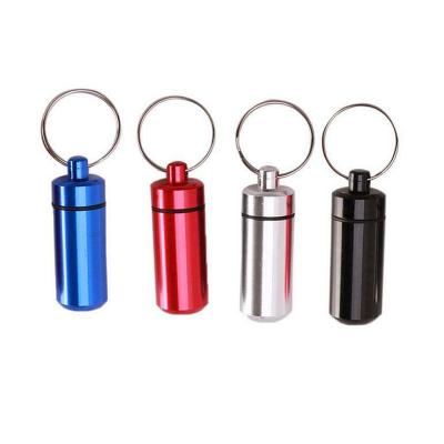 China Hot Sale Metal Key Chain Pill Bottle 7 Days Mini Small Pill Box Bulk for sale