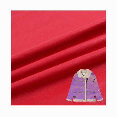 China Shrink-resistant high quality red gilt knitted textile 100% solid polyester suede fabric for clothes for sale