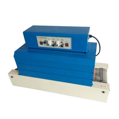 China BS-2520 Small Commodities Automatic Heat Shrink Packaging Machine For Plastic Packaging Heat Shrinkable Film Tableware Shrink Machine for sale