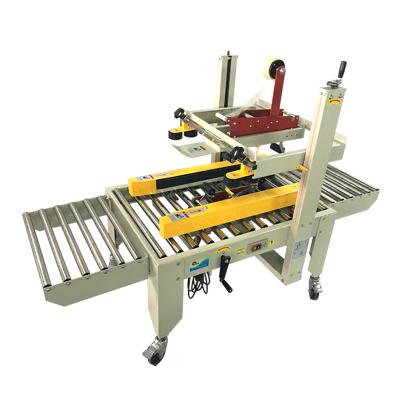 China FXJ-5050 food left and right drive automatic strip sealing machine, can sealing machine for sale