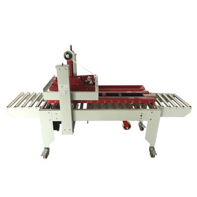 China Automatic Food Adhesive Tape Sealing Machine for left and right drive plane box, No.1 to No.13 small cartons can be sealed for sale