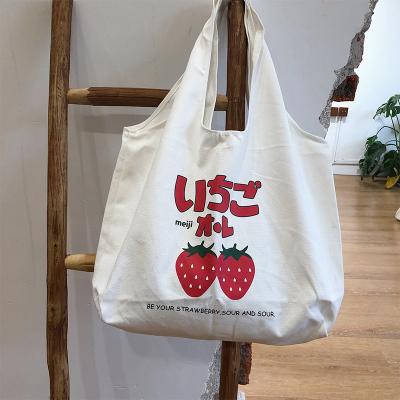 China QJMAX fashion high quality strawberry Japanese wild Harajuku students simple and wild canvas makeup bag for sale