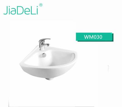 China WM030 Easy Clean Wall Hung Small Ceramic Hand Wash Basin For Corner for sale