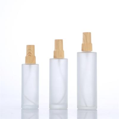 China 50ml Frost Round Cosmetic White Empty Airless Lotion Pump Skin Care Glass Bottle With Pump For Travel for sale