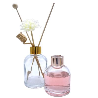 China 100ml Emptry Aroma Bottles Glass Perfume Diffuser Cosmetic Clear Round Luxury Bottle With Reed For Freshner for sale