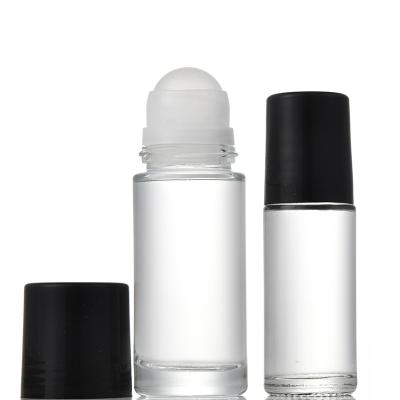 China Cosmetic Clear Round Glass Deodorant 50ml Roll On Perfume Bottle With Plastic Ball And Plastic Cap for sale