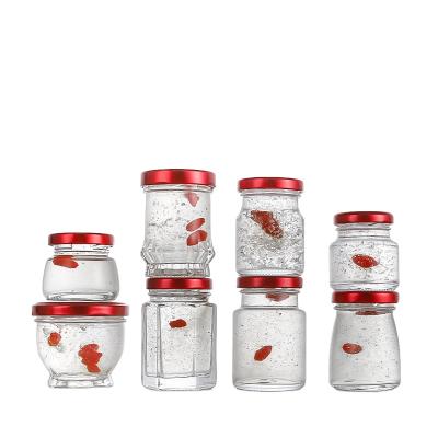 China Small glass food jars for baby food packaging jar honey jar glass with metal lid for sale