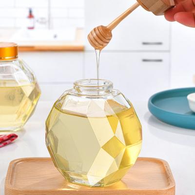 China Unique Shaped Food Honey Jars Honey Storage Container Empty Bottle Glass with Bamboo Lid and Metal Lid Wood Dipper for sale