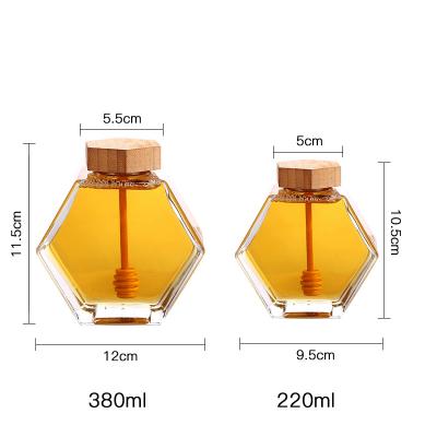 China Wholesale Clear Empty Hexagon Food Honey Glass Jar Tranparent Glass Honey Packing Bottle With Tight Lid for sale