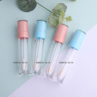 China Wholesale Cosmetic Packaging 8ml Cylinder Round Empty Light Blue Peach Lip Gloss Packaging Custom Clear Lip Gloss Tubes for sale