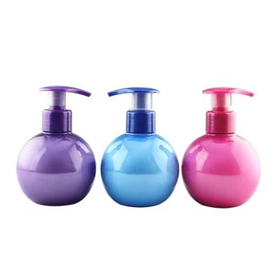 China Wholesales Cosmetic Ball Shape Pink Purple Blue PET Plastic Lotion Pump Bottle 220g For Toothpaste Shampoo Shower Bath Toner Lotion for sale