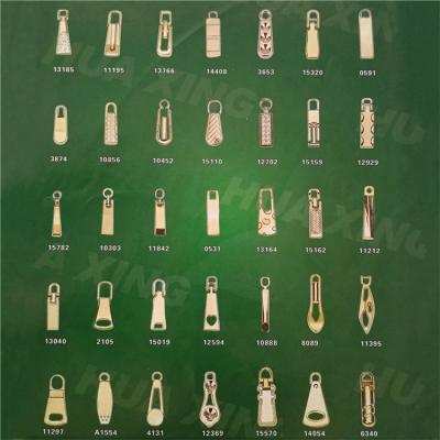 China NO.3#5# Rectangle Metal Pattern Durable Matte Gold Zipper Puller Slider Beautiful Fashion And Pull Parts For Garment Bags Shoes for sale