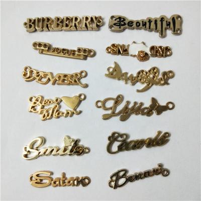 China Washable Rhinestone Diamond Metal Label Apparel English Alphabet Brand Logo Letter Badge Trademark for sale