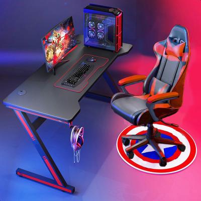 China Simple and Modern Style Office Racing Table Z Shaped PC Computer Desk Game Table with Free Mouse Pad Handle Holder for Gamer for sale